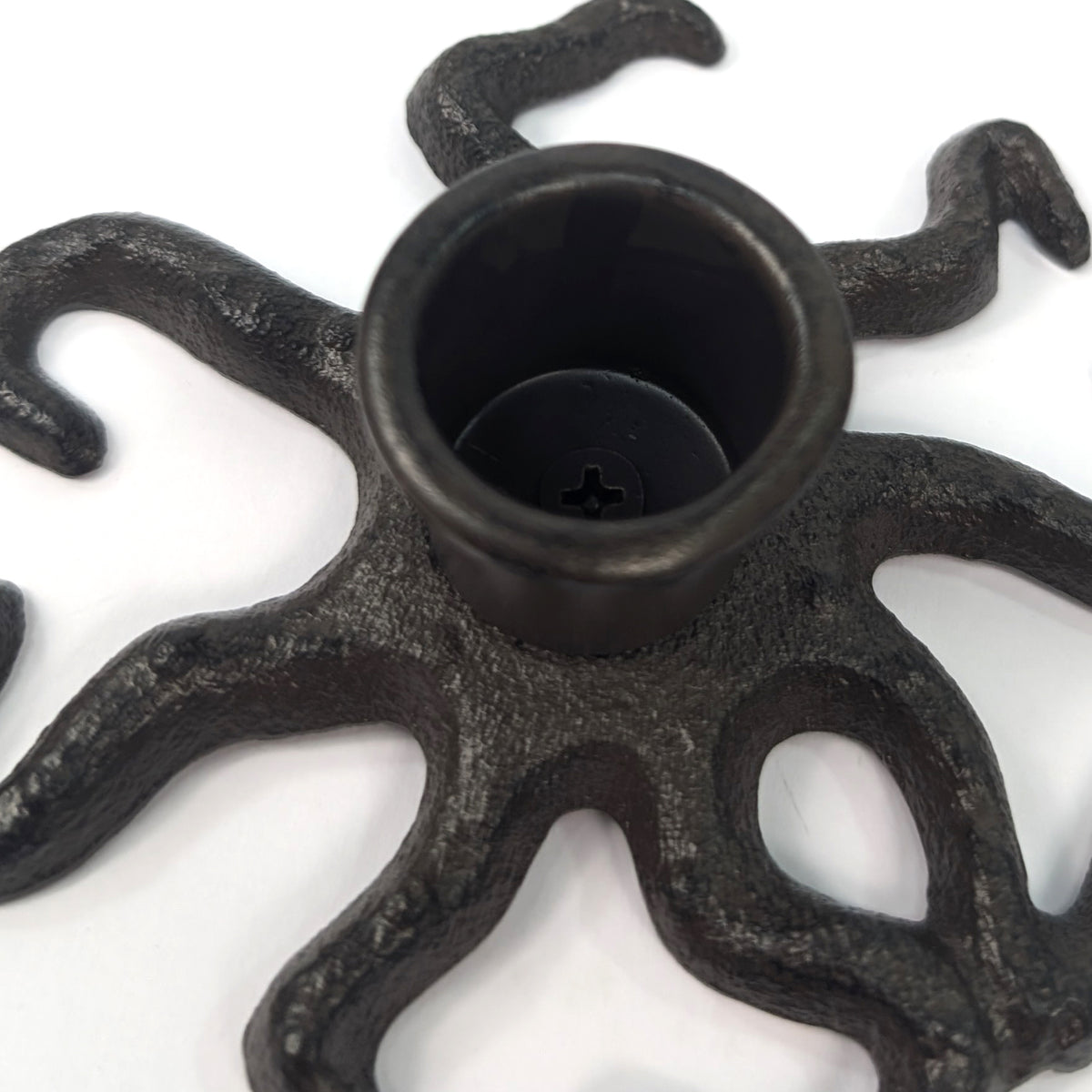 Close-up of the octopus candle holder socket and textured cast iron tentacles
