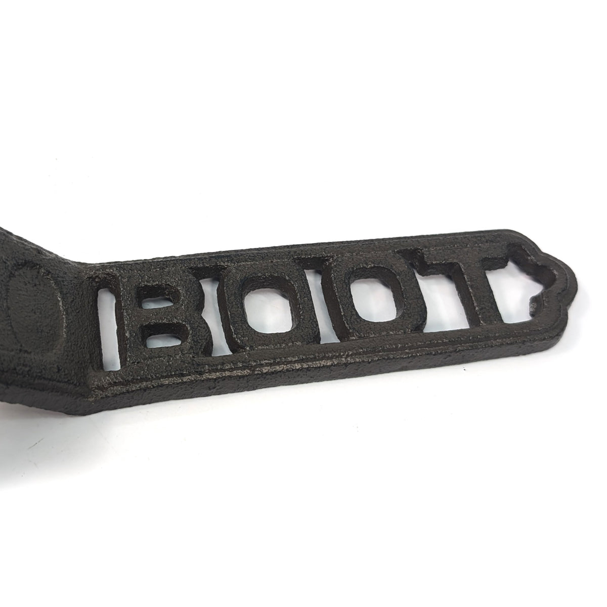 Close-up of the cut-out BOOT lettering and cast iron texture