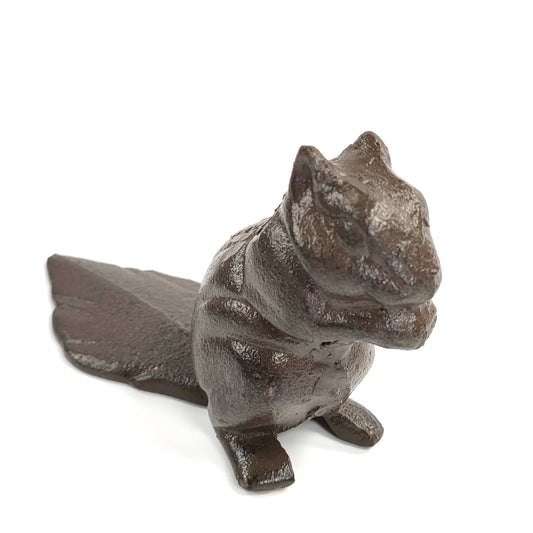 Angled view of the cast iron squirrel door stop and tapered tail on a white background
