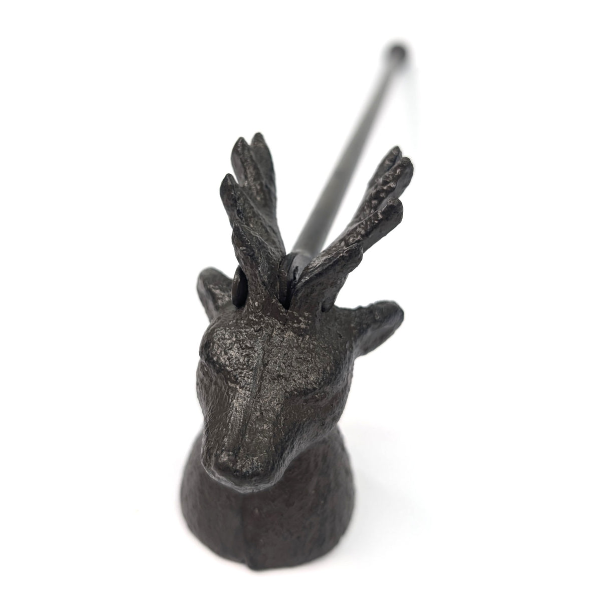 Close-up of the candle snuffer's stag face and antlers