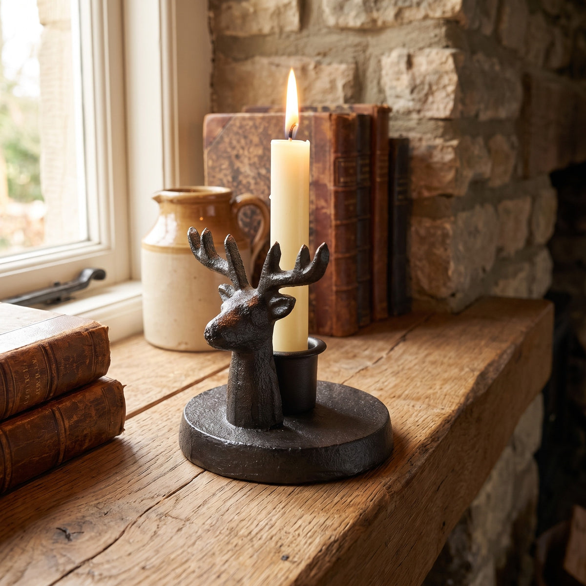Stag candle holder with a candle in a country farmhouse setting