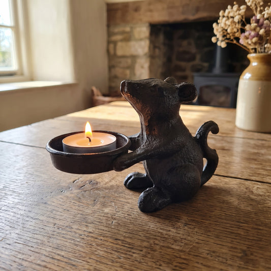 Mouse candle holder on a farmhouse wooden table
