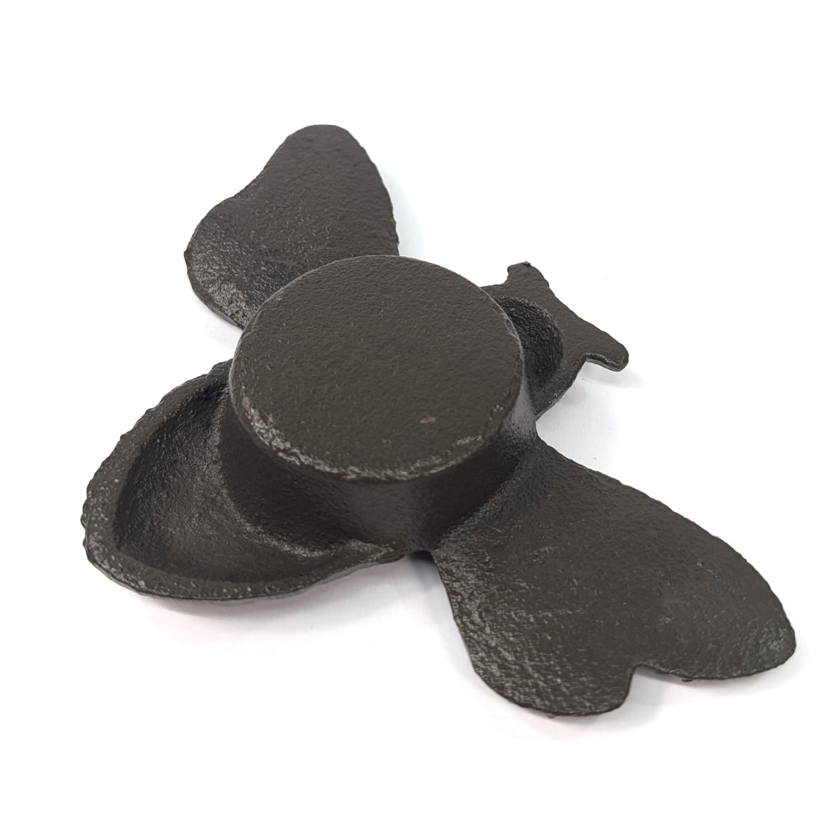 Underside of cast iron bumble bee tea light holder