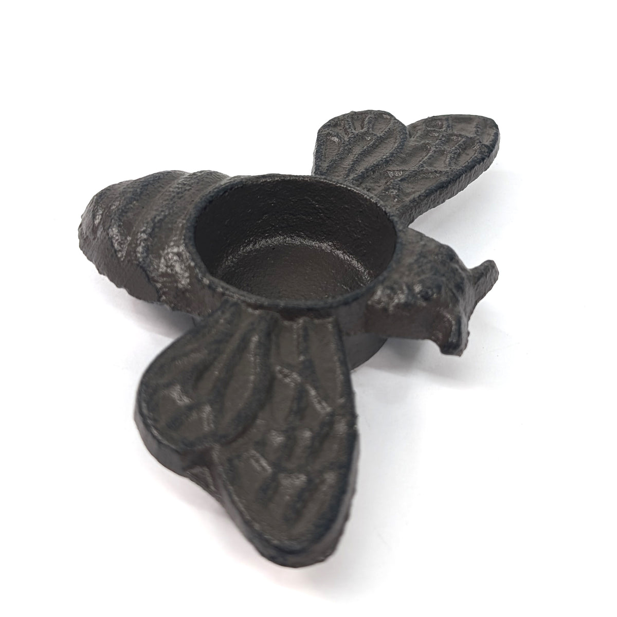 Side view of bumble bee tea light holder showing its head, wings and candle cup