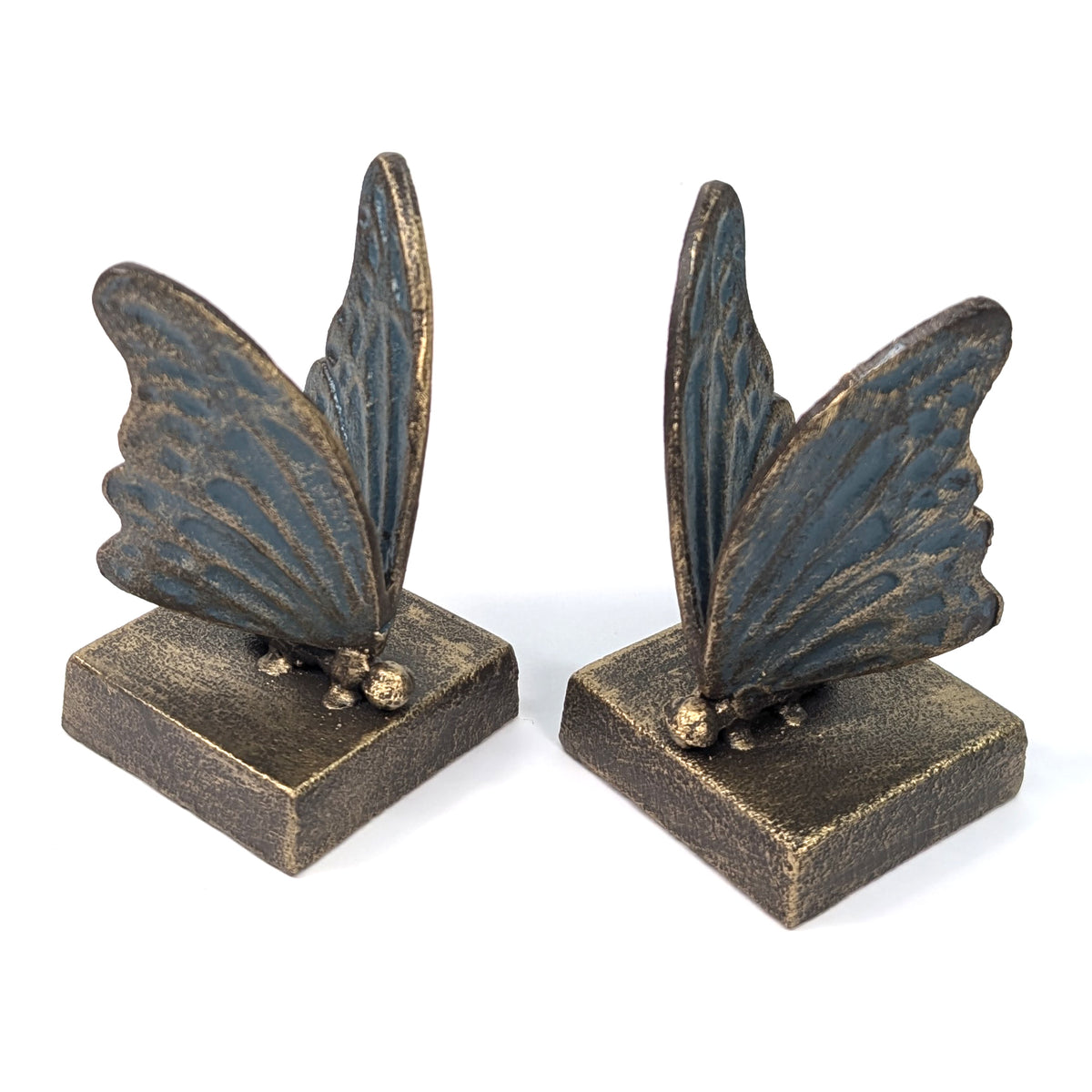 Pair of blue and gold cast iron butterfly bookends on square bases