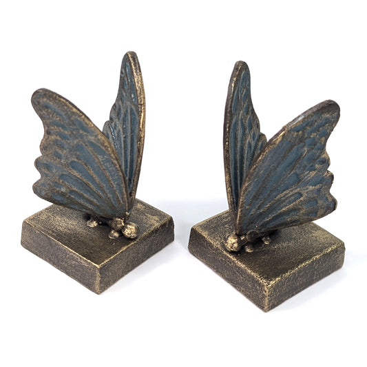 Pair of blue and gold cast iron butterfly bookends on square bases