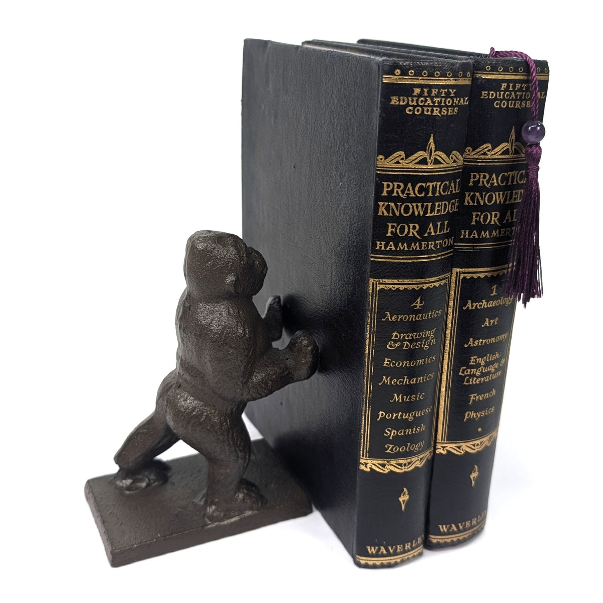 Gorilla bookend pushing against books with outstretched hands